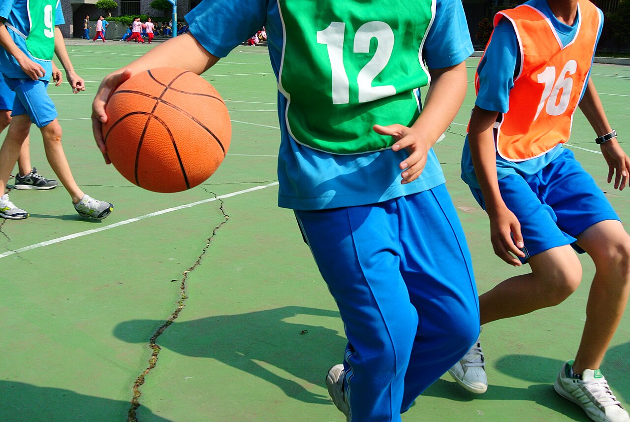 Guard pushing the ball up court in transition before the defence sets