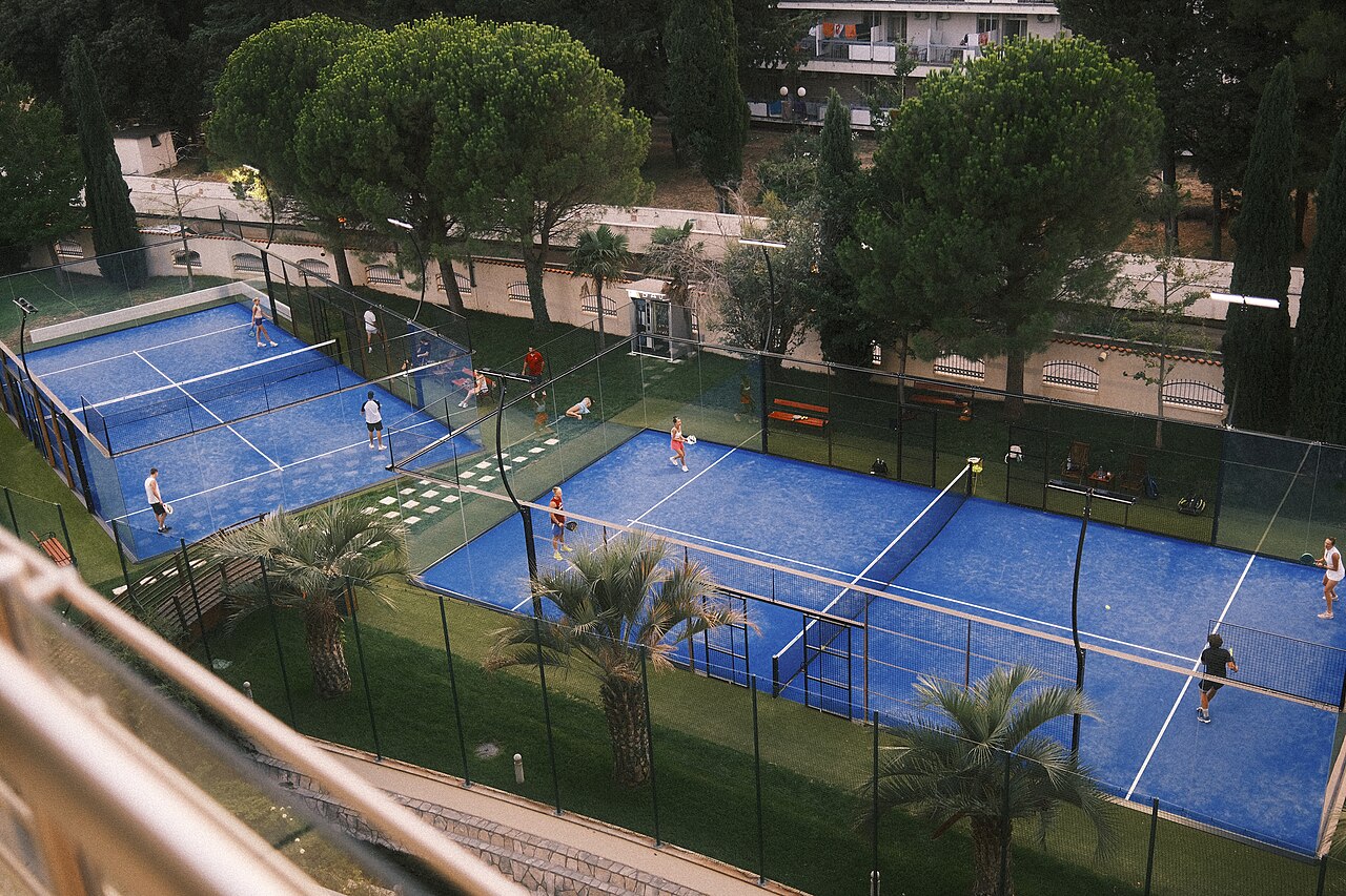 Doubles pair at the net between points on a hard court